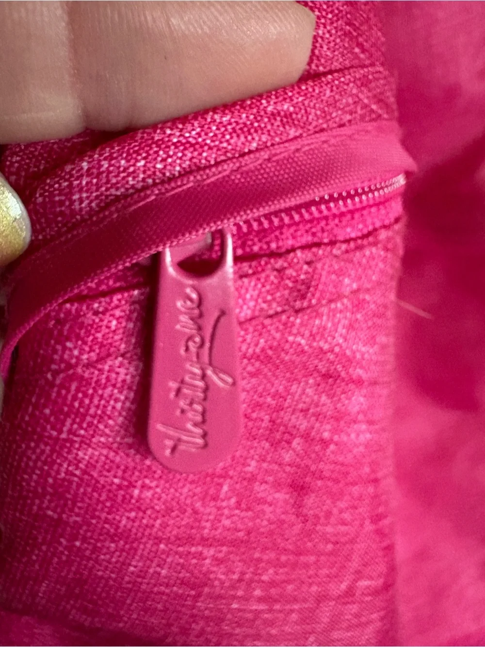 Cute personalized drawstring backpack in a vibrant pink fabric, letter L